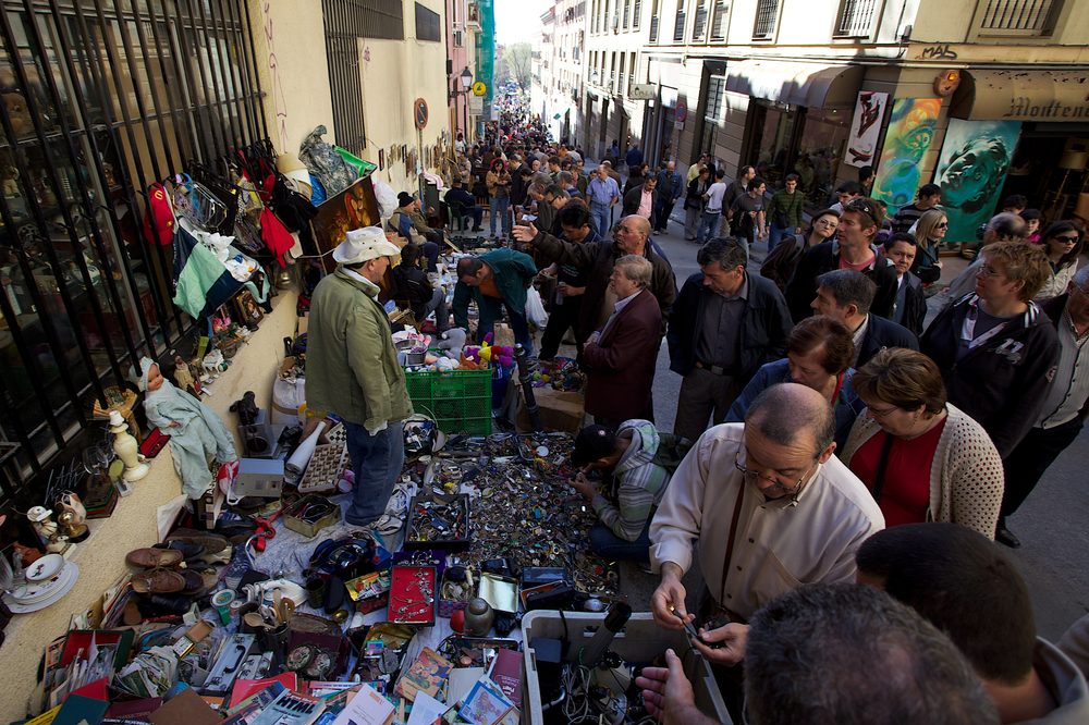 El Rastro flea market stalls selling household goods in Madrid, Spain