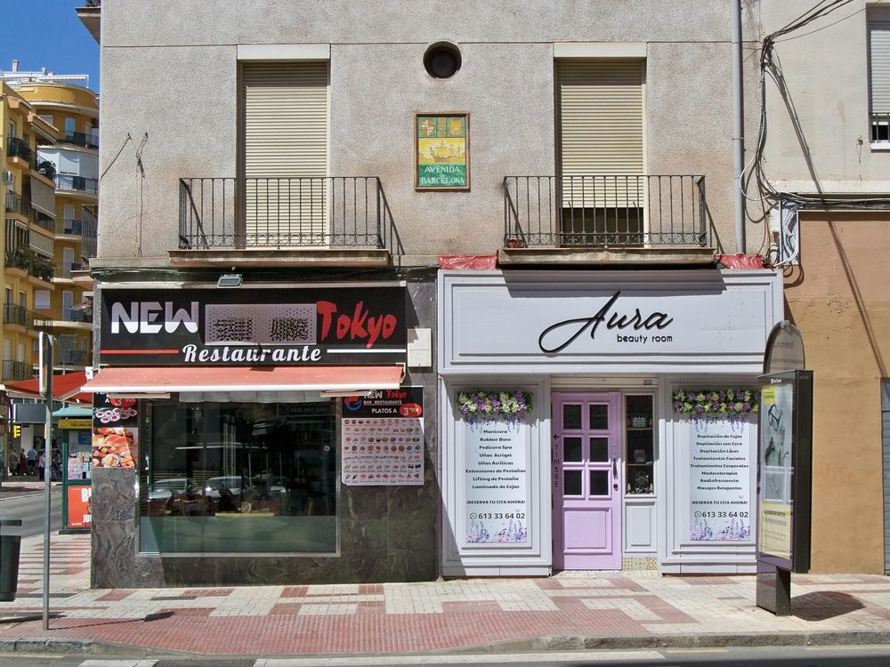 Street sign in Spanish on a building in Barcelona, Spain