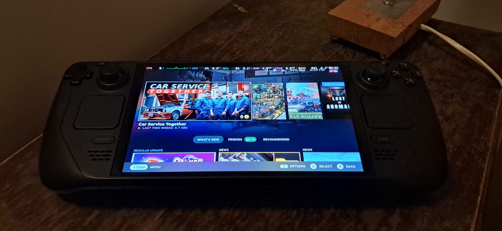 Steam Deck OLED handheld gaming device shown on its home screen