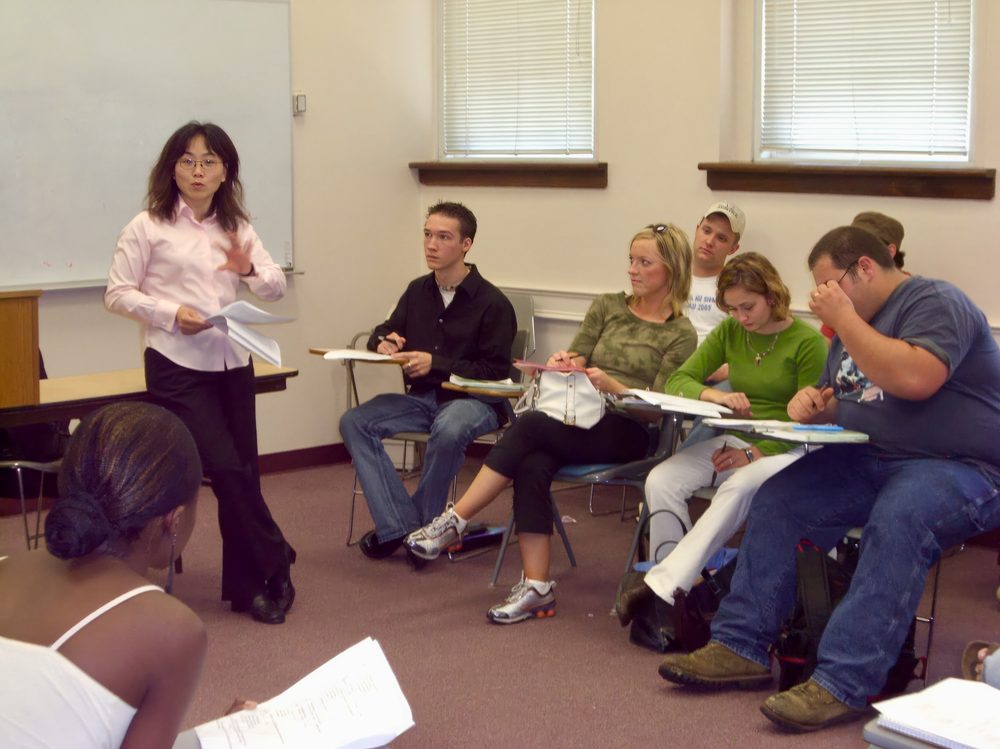 University classroom with students and a professor, representing English language learners