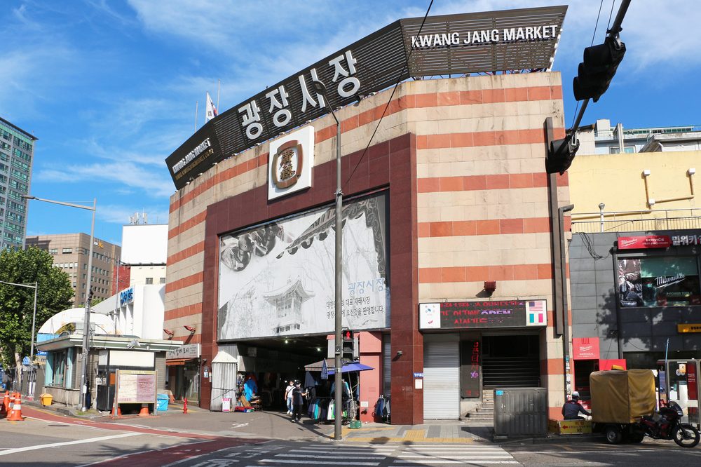 Vendors and shoppers at Gwangjang Market, a traditional food market in Seoul, South Korea
