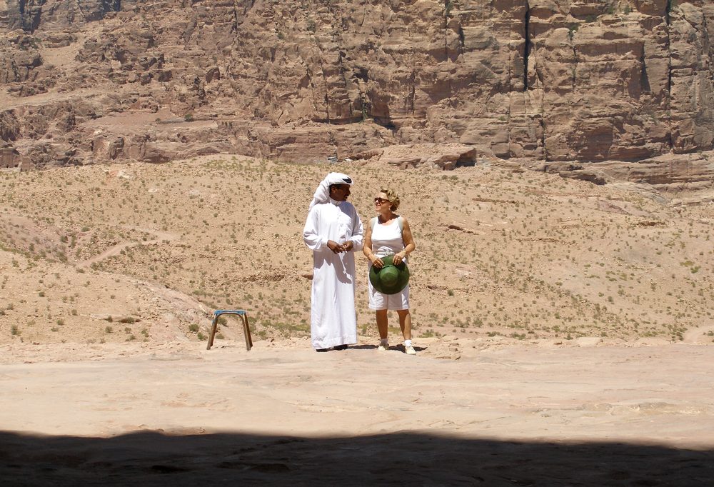 Two people talking outdoors in Petra, Jordan