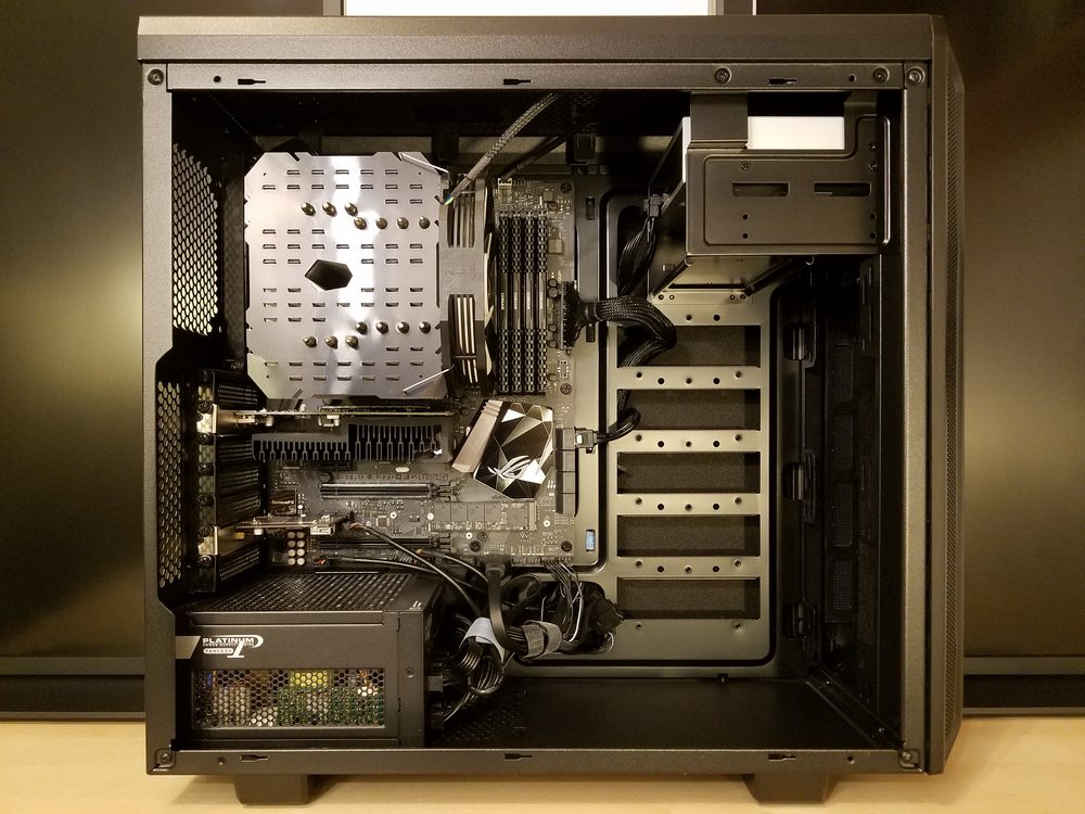 Inside of an open desktop computer case showing the motherboard and graphics card